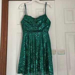Emerald green sequins homecoming dress with black base. Most likely a small